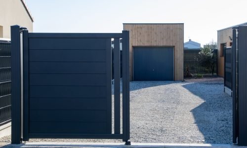 open-grey-double-portal-large-metal-gate-high-gray-suburb-street-house-garage-door open grey double portal large metal gate high gray on suburb street house garage door